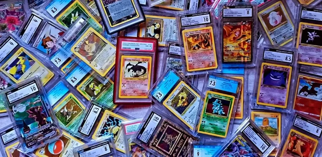 and image of a set of many high end tcg cards incuding pokemon and one peice